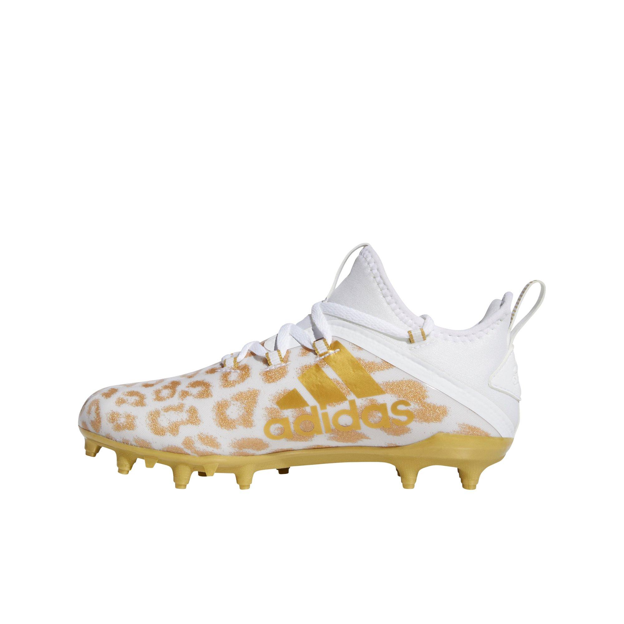 white and gold cleats