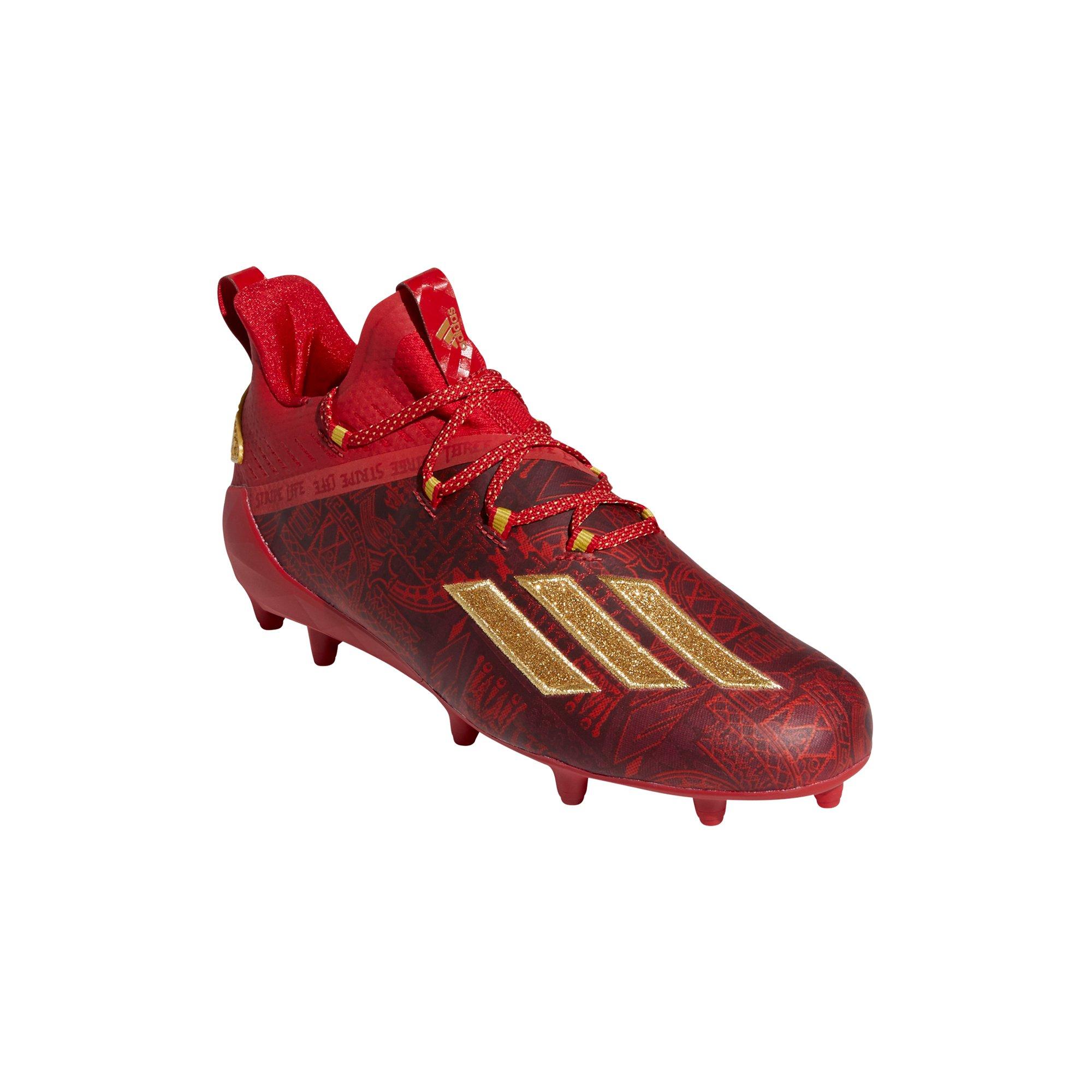 red and gold adidas football cleats