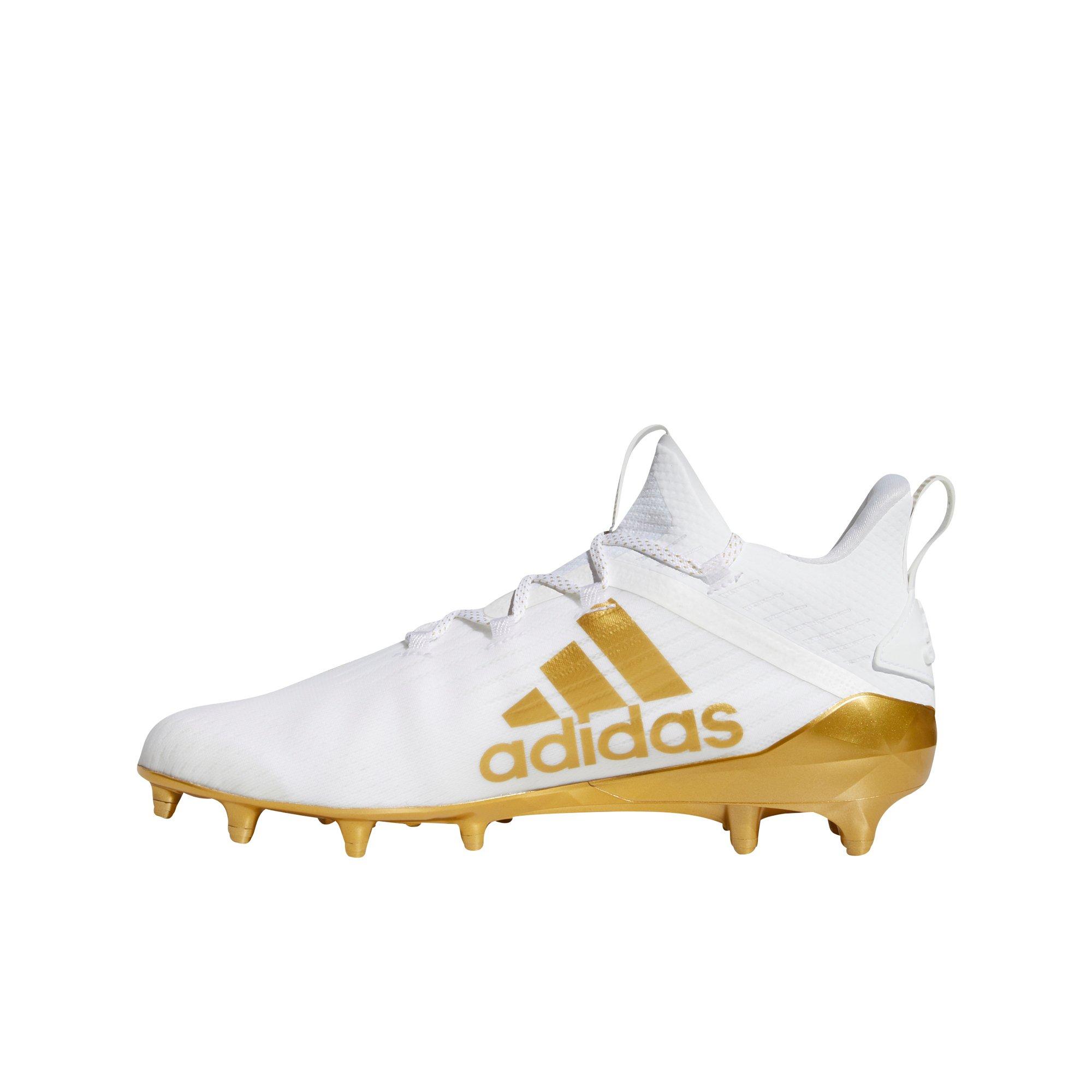 gold and white adidas football cleats