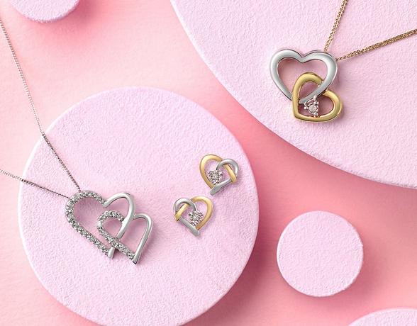 Silver and yellow gold heart pendant and stud earrings