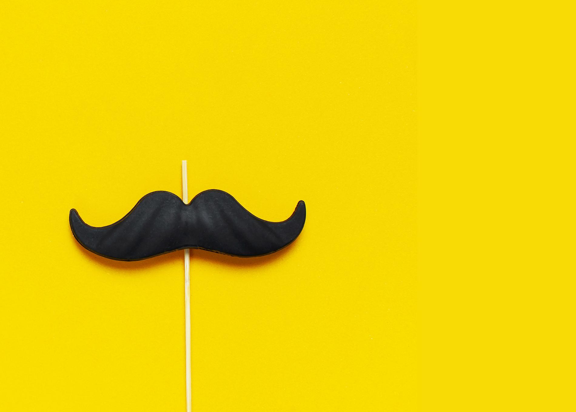mustache against a yellow background